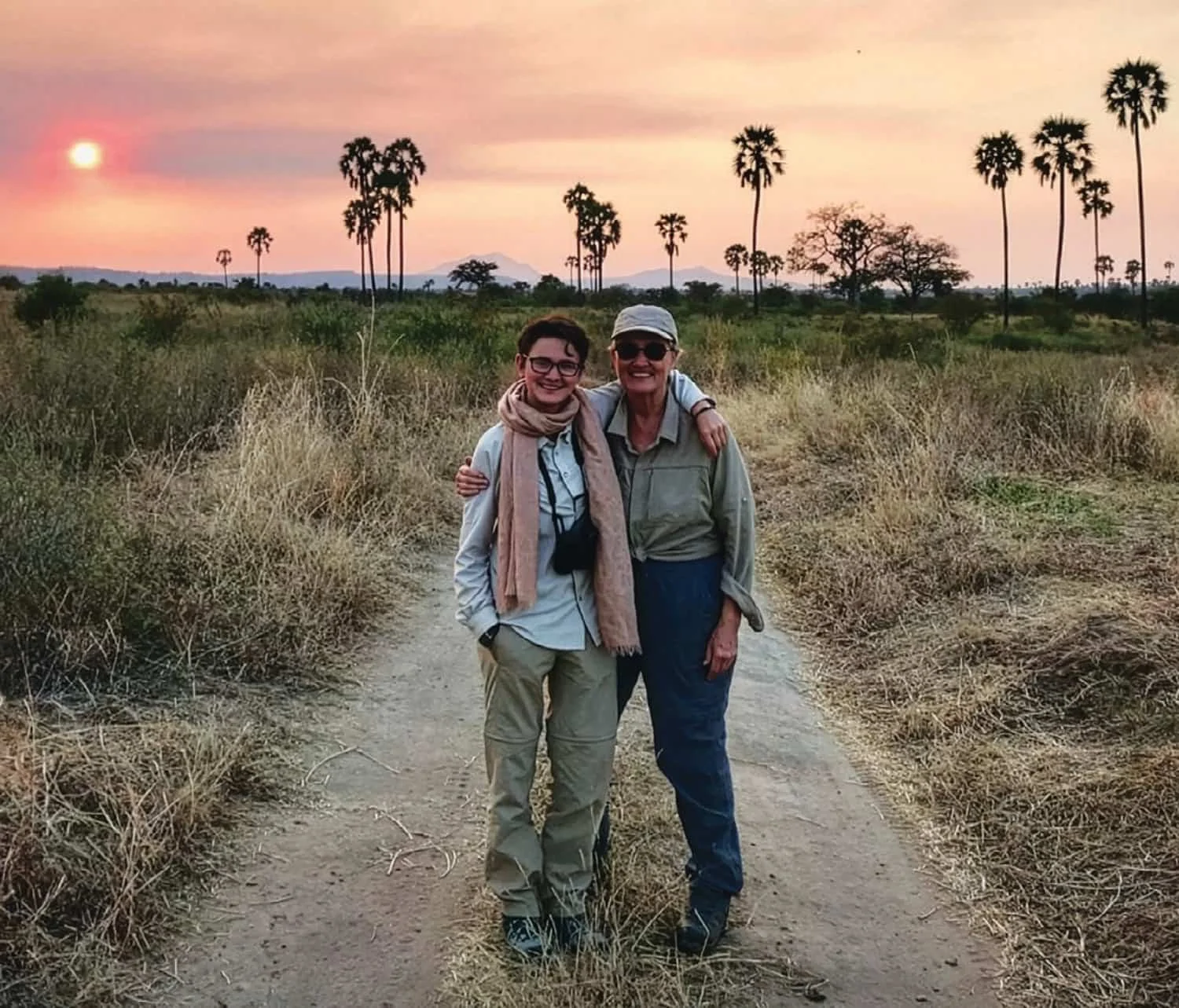 Susan Magee and granddaughter Natalia enjoying the sunset during their African safari