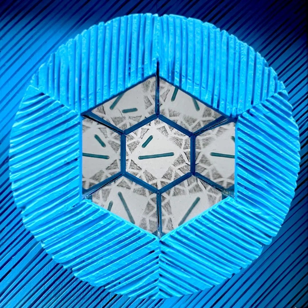 A geometric light fixture with a blue outline, revealing a star-shaped pattern and multiple clock faces inside.