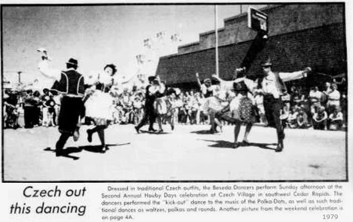 Traditional Czech dancers perform a folk dance outdoors during Czech Village’s Second Annual Hound Dog Days celebration in 1979, with people dressed in Czech costumes and spectators watching.