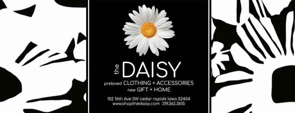 Advertisement for Daisy, a store selling clothing, accessories, gifts, and home decor, with a daisy flower image and black-and-white floral background.