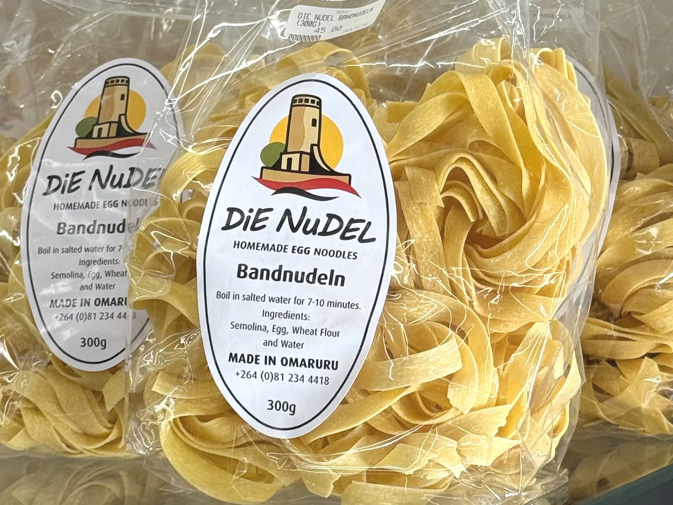 Clear plastic bag containing homemade egg noodles labeled "DIE NUDEL" with ingredients and cooking instructions.