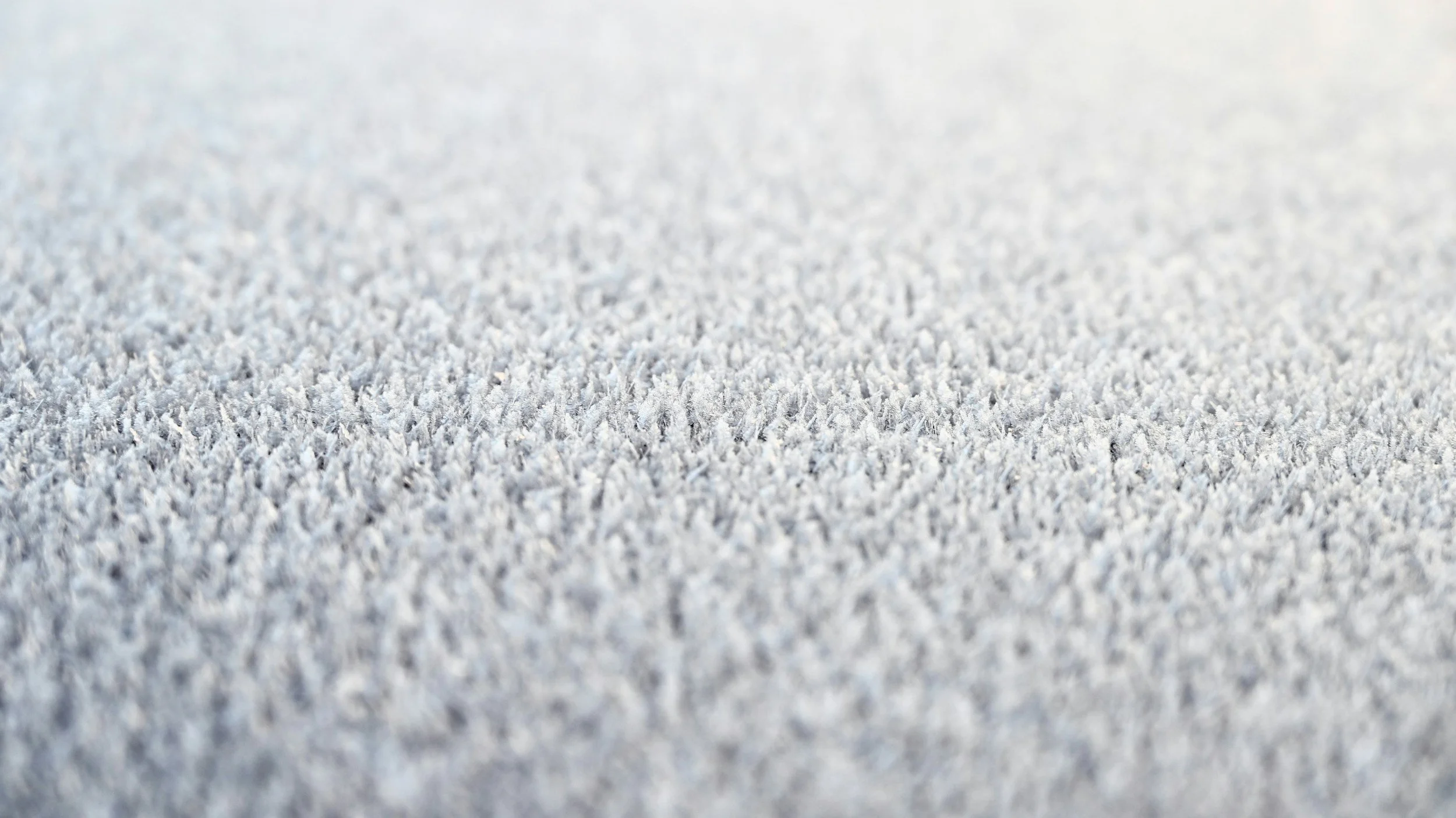 Close-up view of snow covering a flat surface
