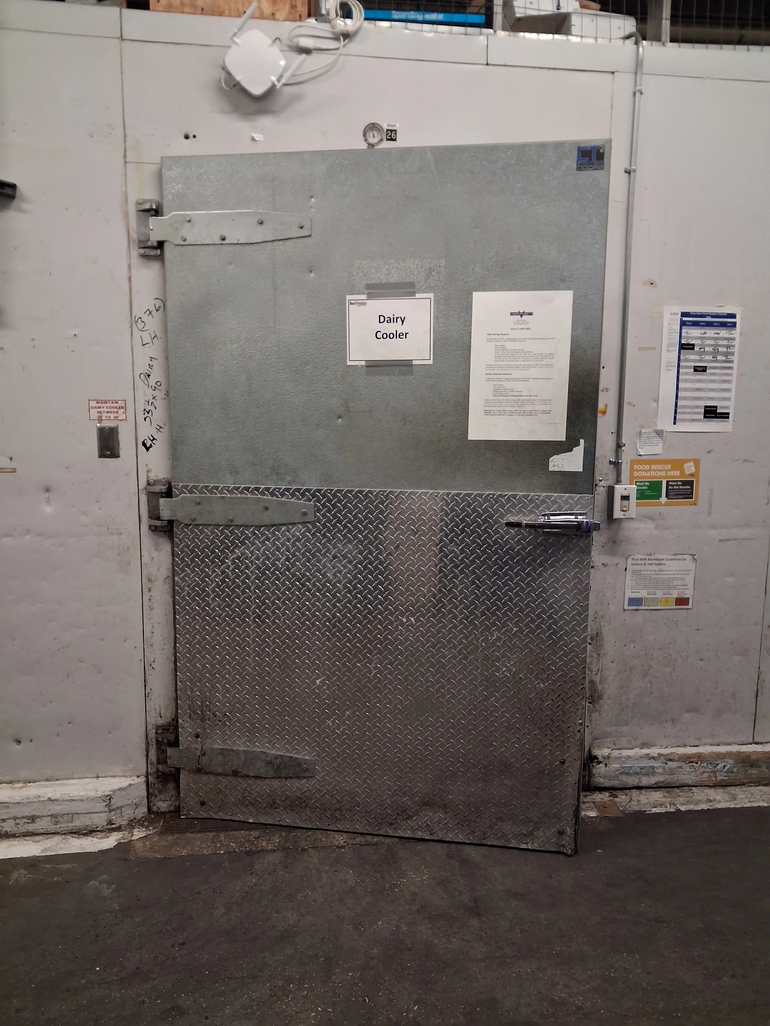 Commercial walk-in cooler door before repair