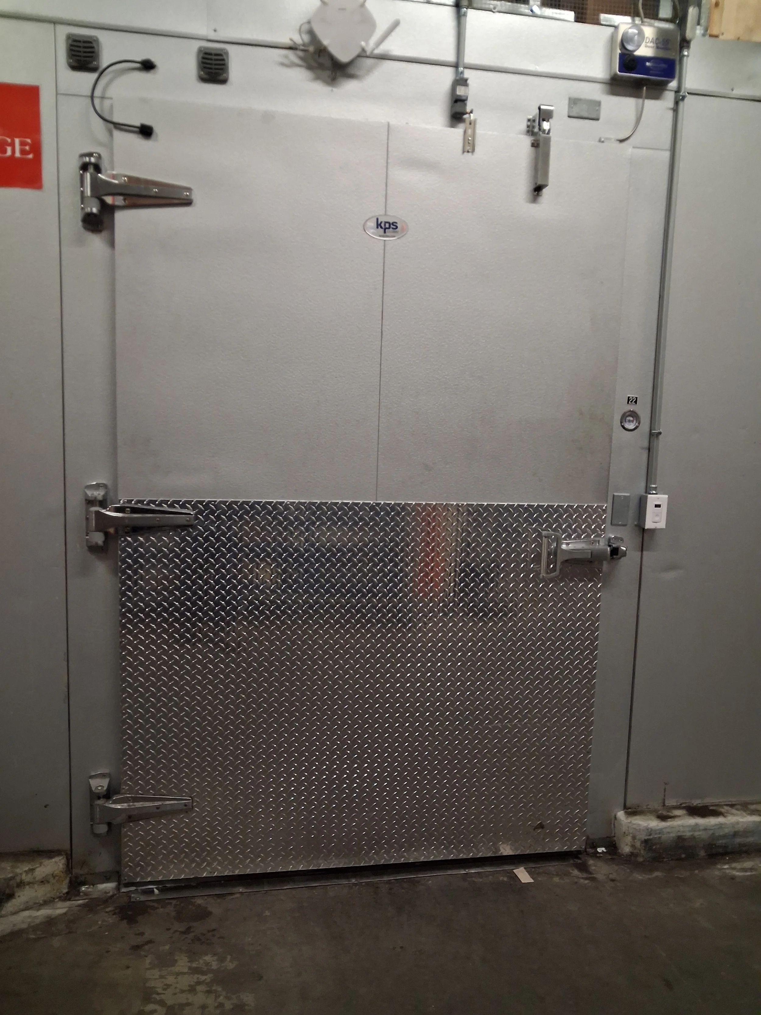 Commercial walk-in cooler door after repair