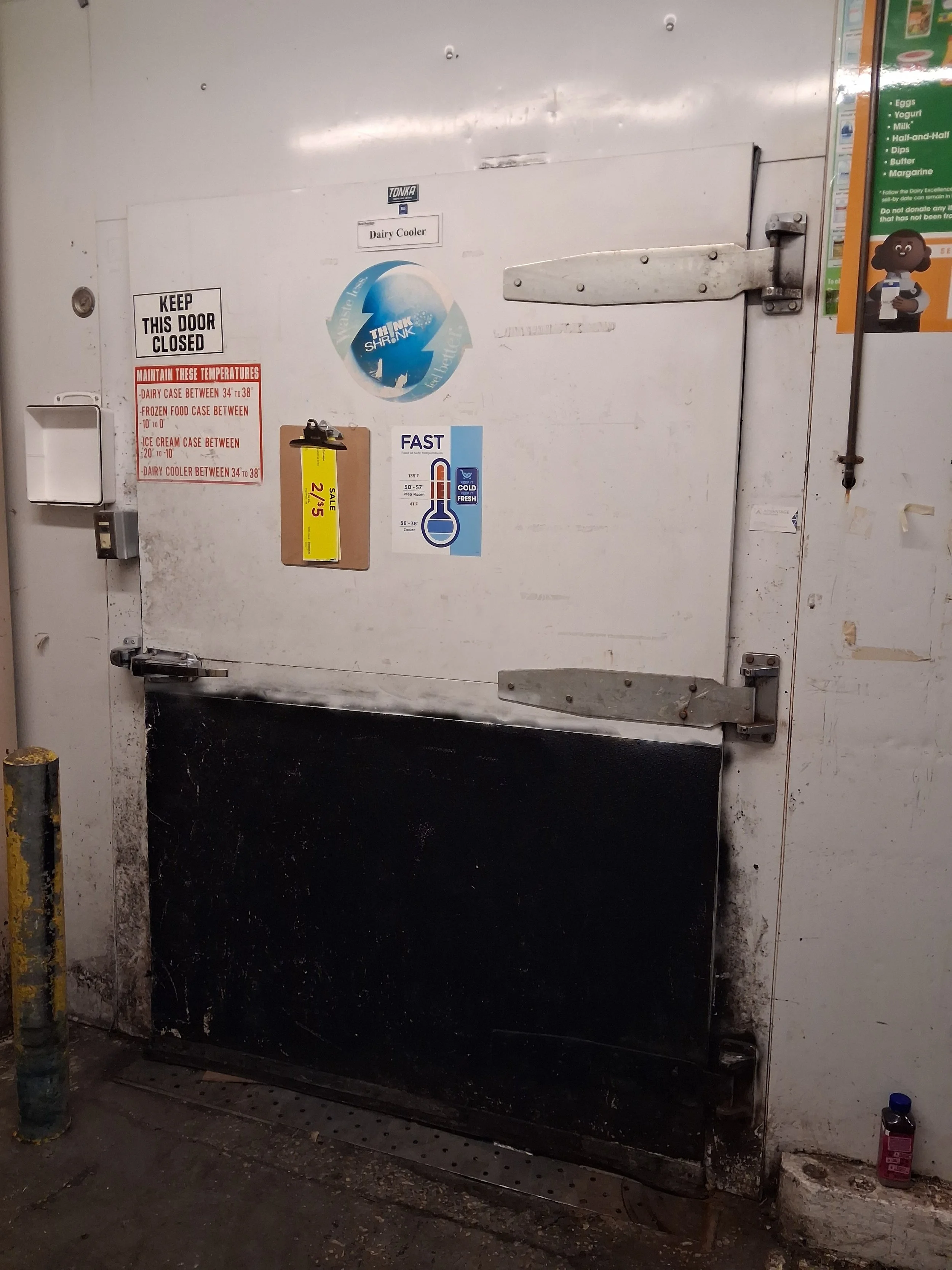Commercial walk-in cooler door before repair