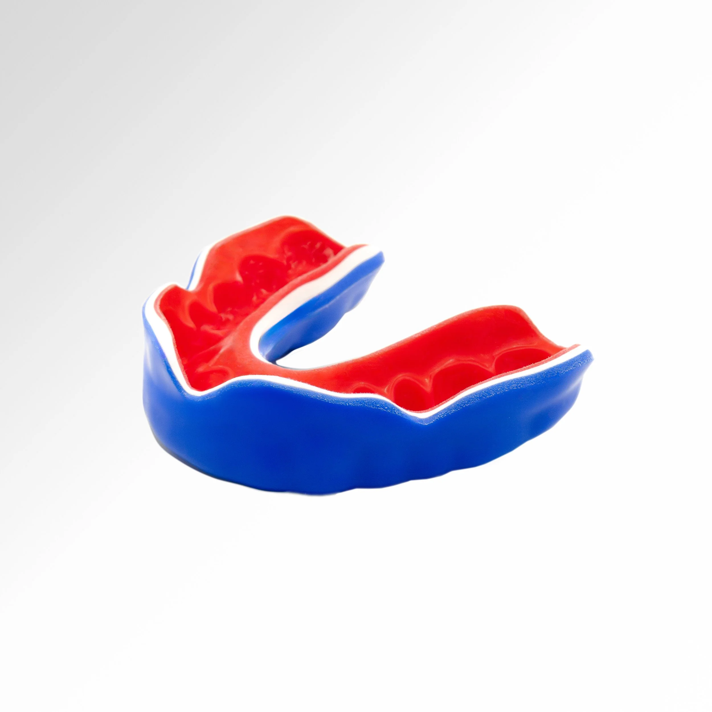 Close-up of a decorative patriotic-themed Sports guard with red, white, and blue colors against a white background.