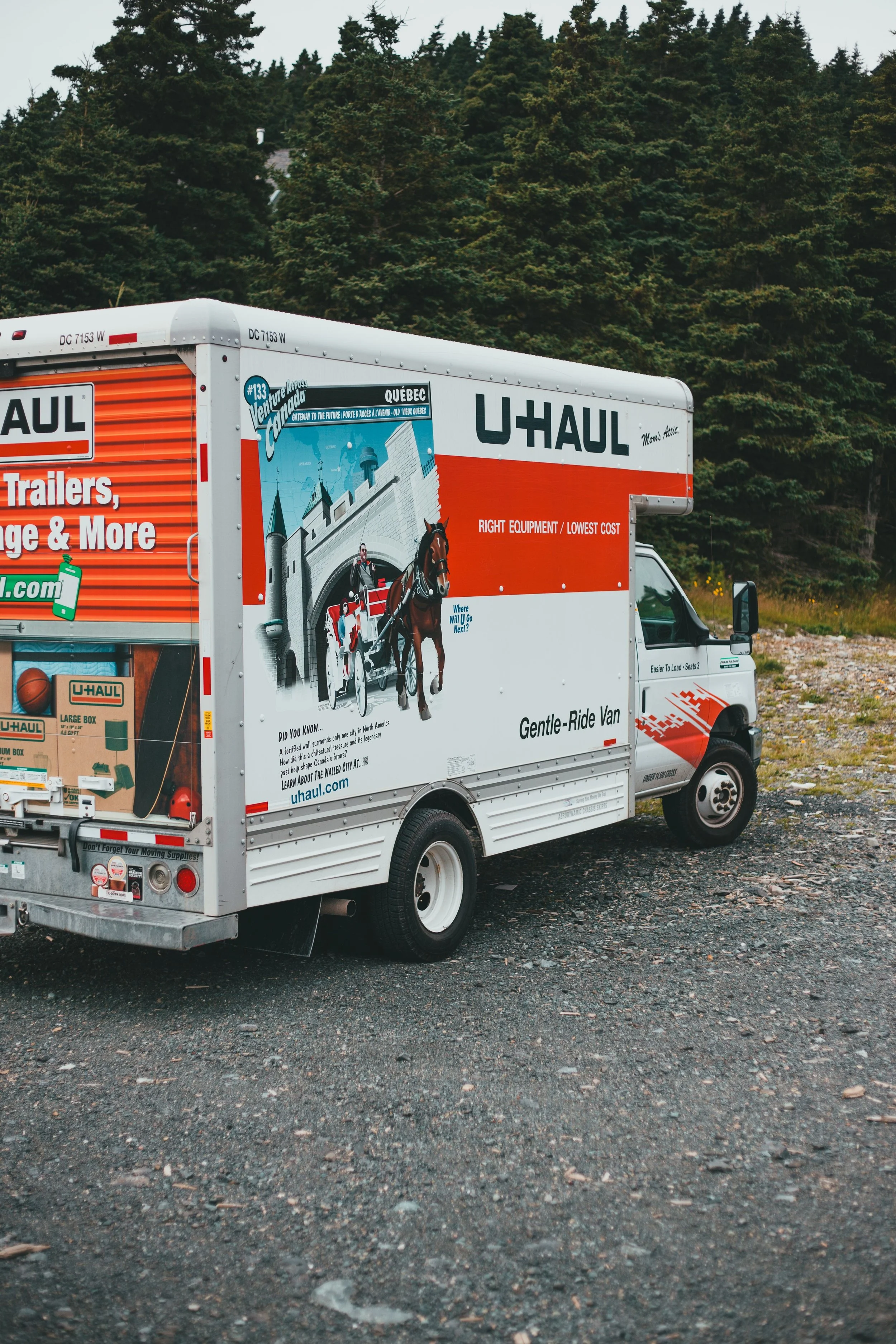 Moving truck parked outside to assist with home relocation and moving services.