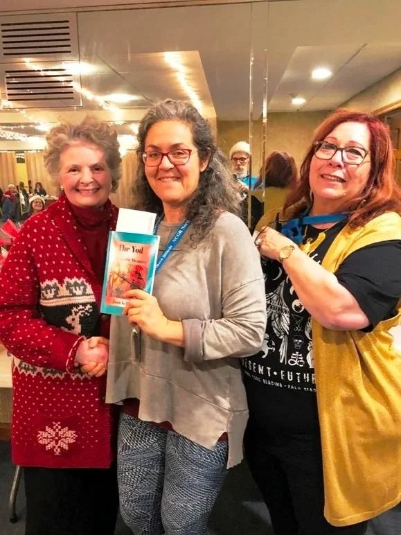 Three members smiling together at a live NCGR Northern Illinois Chapter meeting