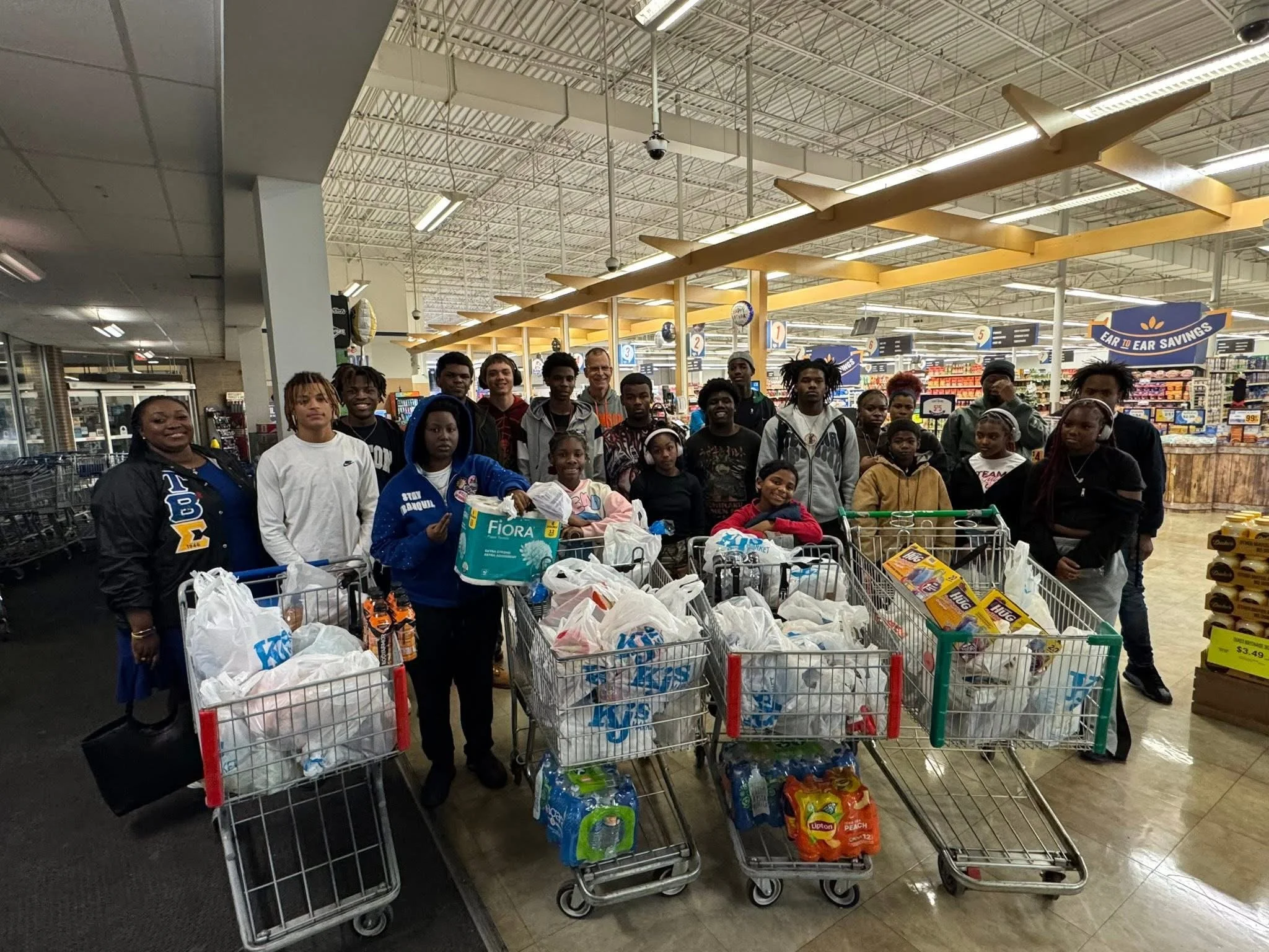 Sons of Legacy mentees serving their community during a group outreach project
