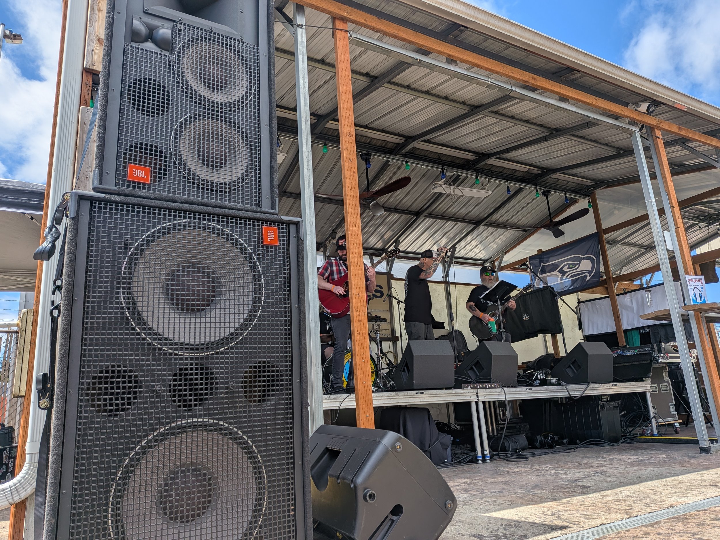 Large sound system with a local band doing a sound check.