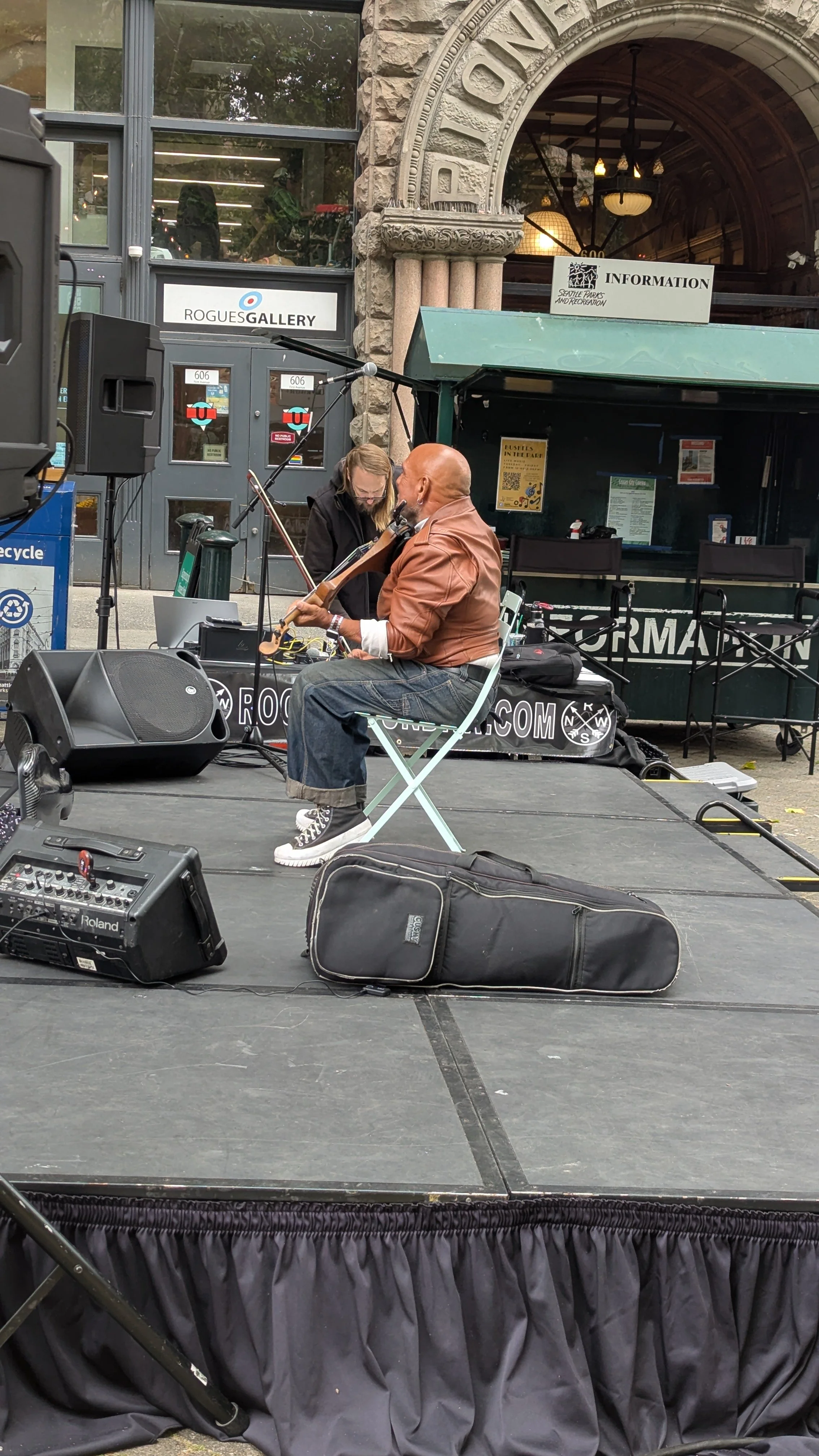 A violinist plays on stage in Pioneer Square, Seattle.