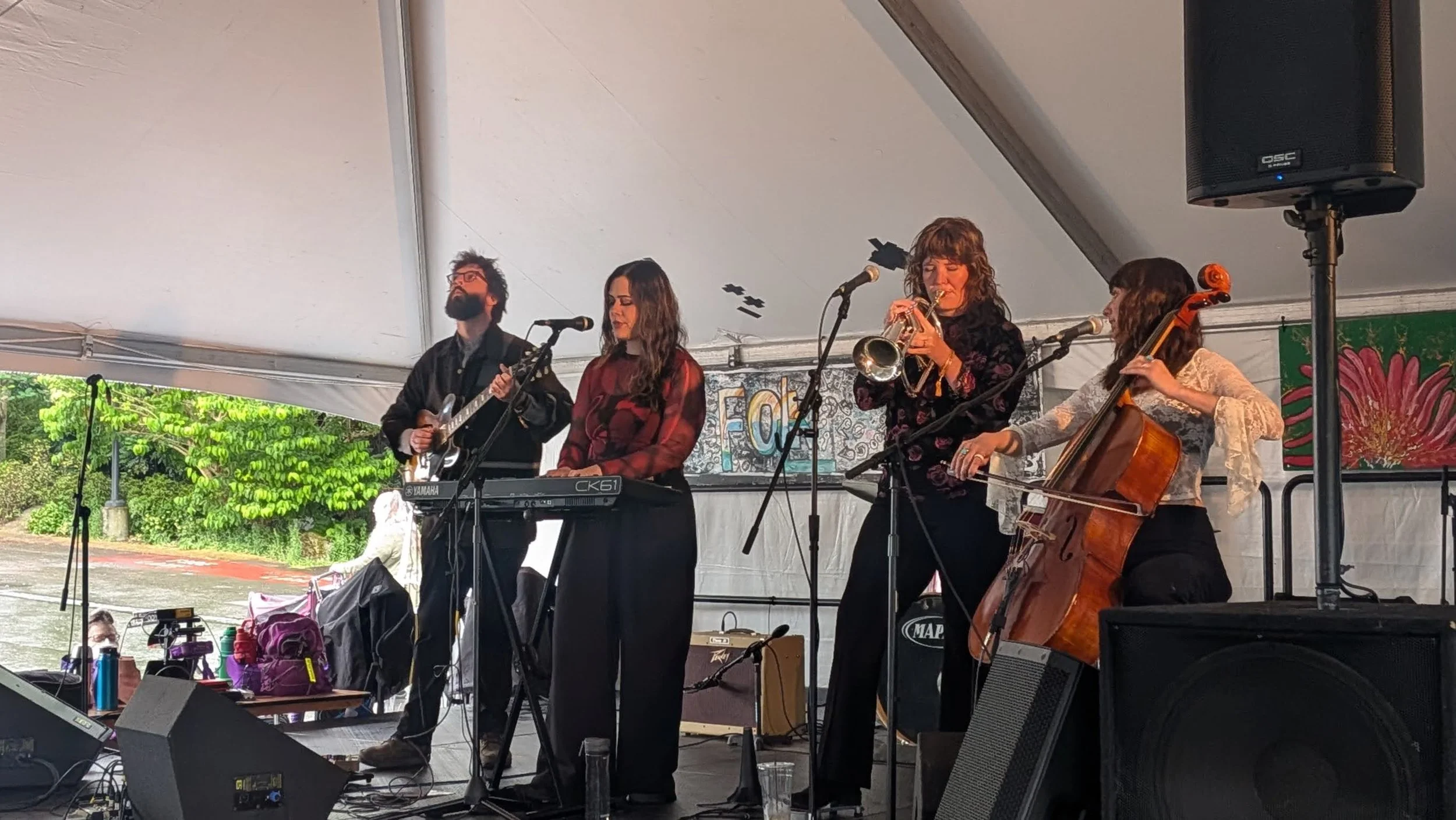 One of the many bands at Northwest Folk Life at the Seattle Center, a four-piece band with strings, horns, and keys. 