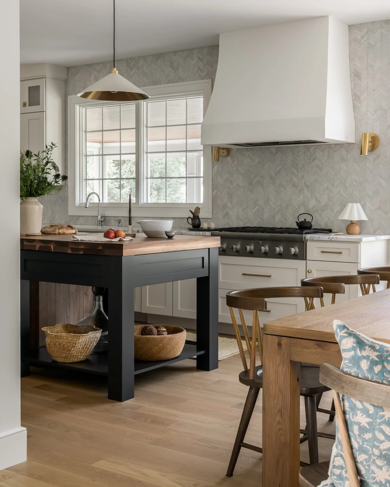 kitchen with white cabinetry and dark center island