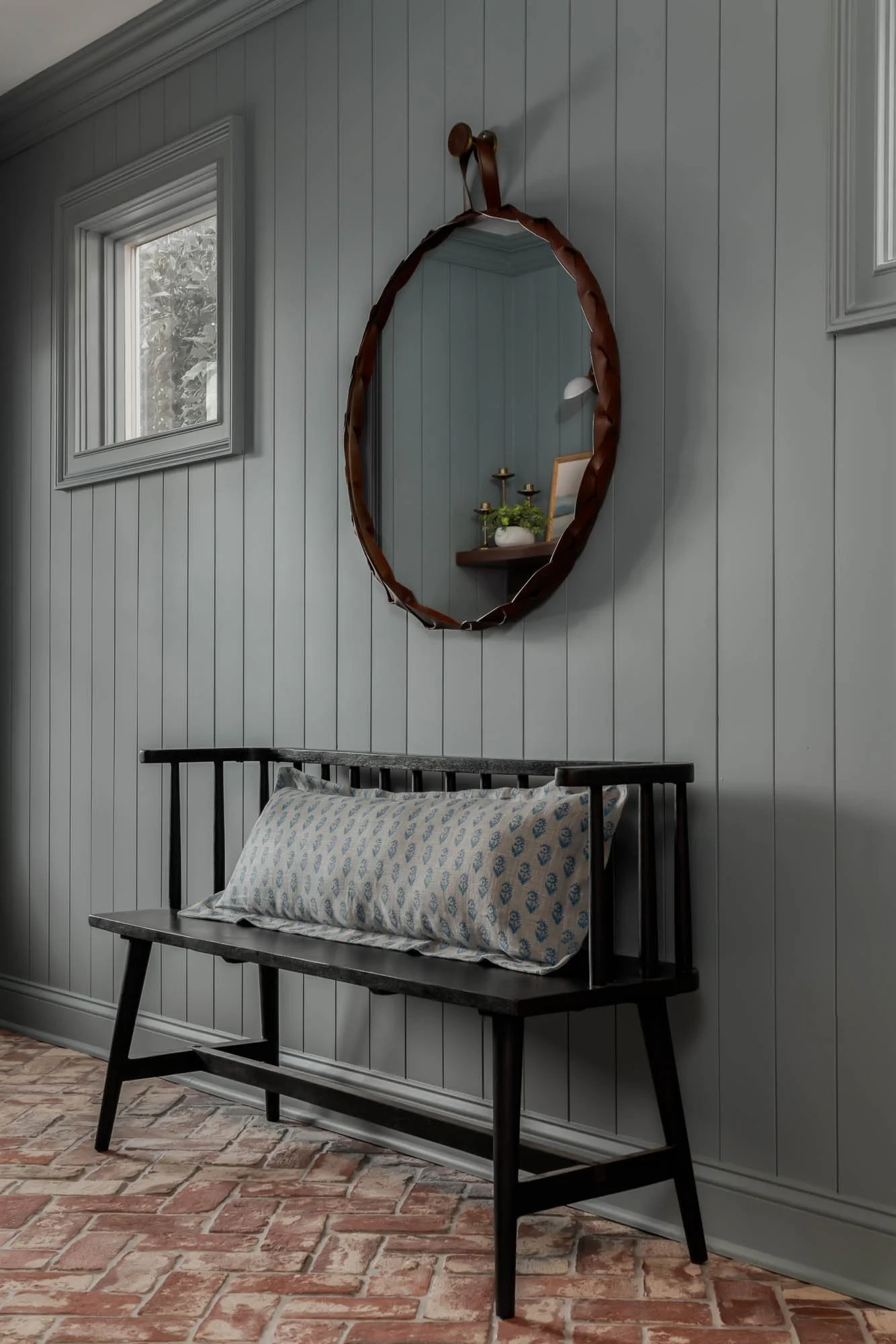 blue wooden wall with bench and mirror