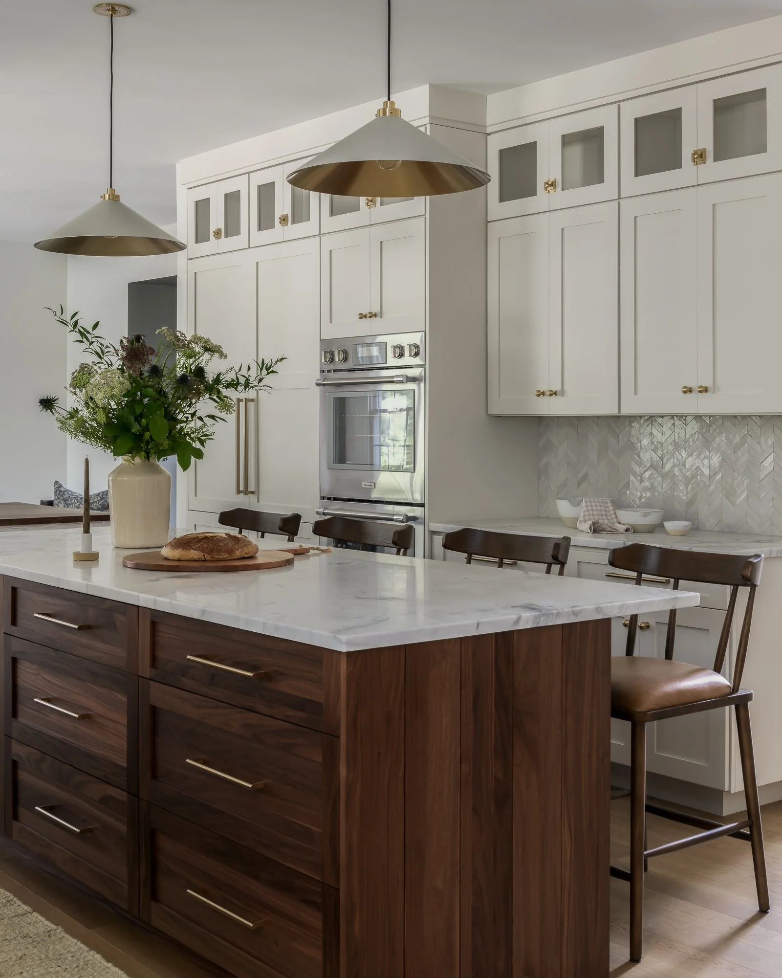 kitchen with white cabinetry and dark center island