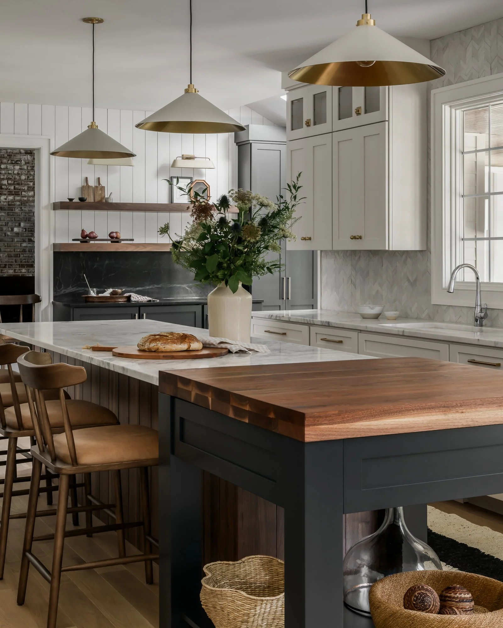 kitchen with white cabinetry and dark center island