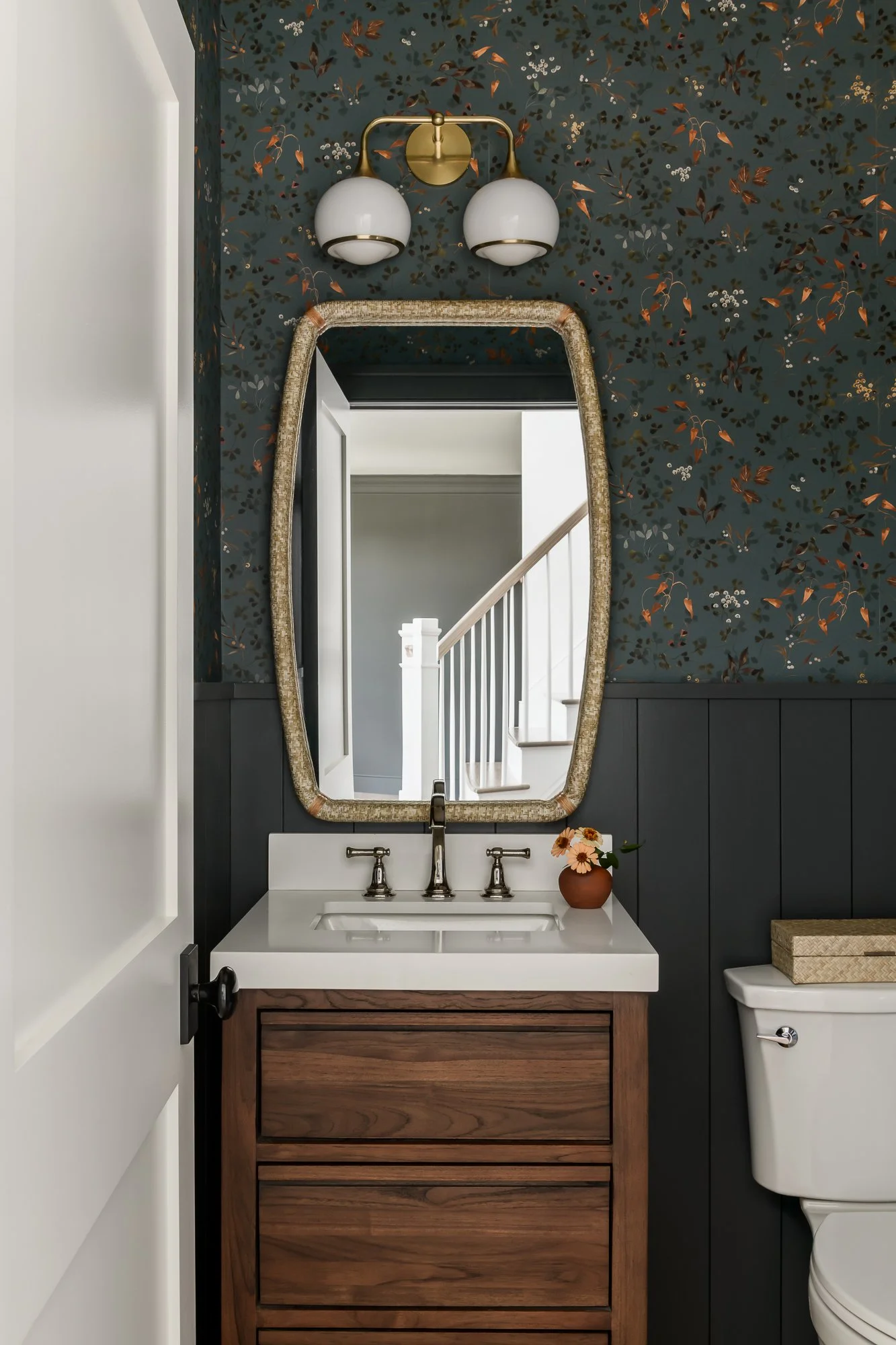 powder room with patterned wallpaper