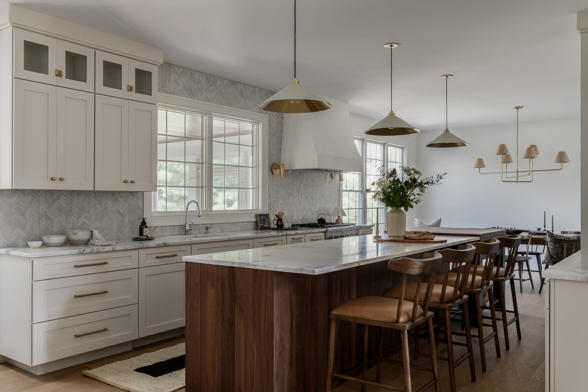 kitchen with white cabinetry and dark center island