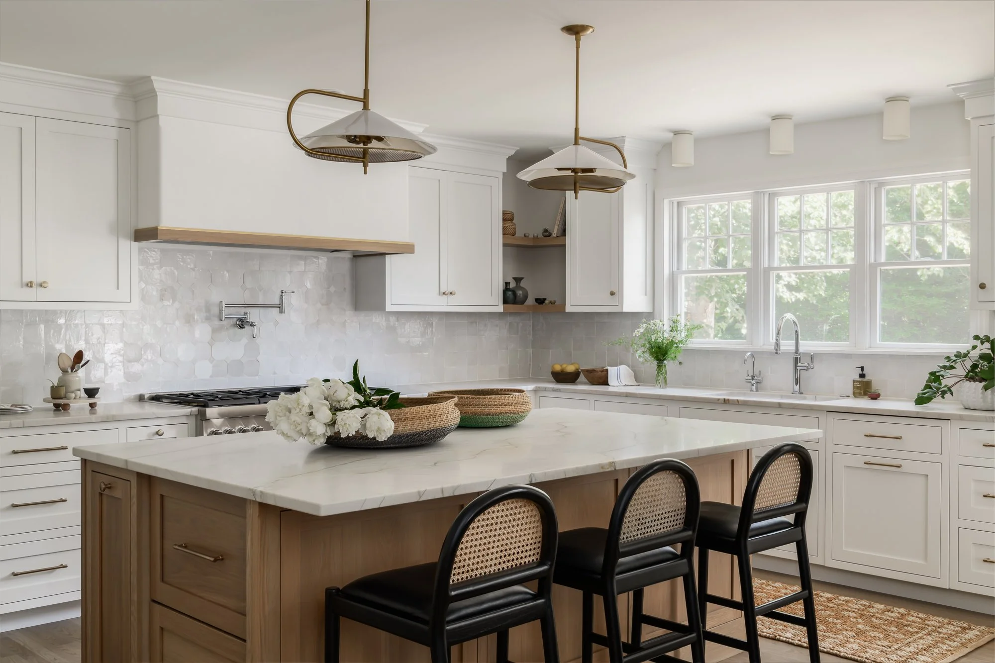 kitchen white cabinetry and rattan details