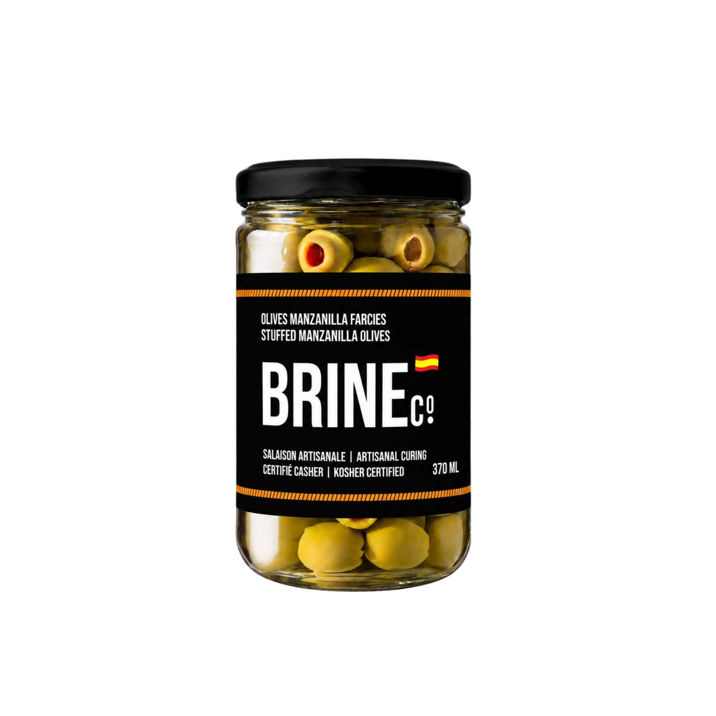 A glass jar labeled 'Olives Manzanilla Farcies Stuffed Manzanilla Olives' contains green olives with stuffing, featuring orange and brown fillings, and is marked as kosher and artisanally cured.