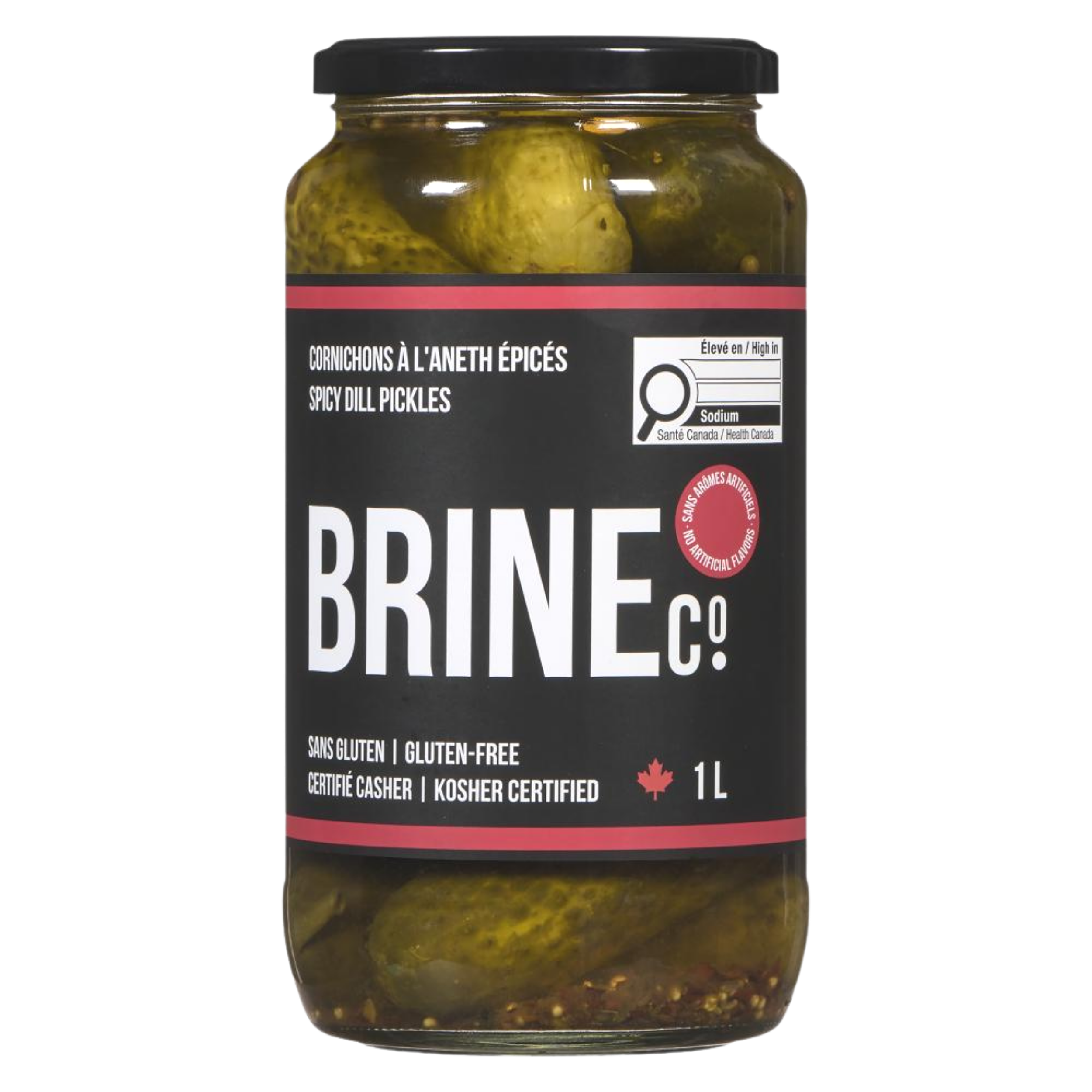 A jar of spicy dill pickles with a black lid, label indicating it's gluten-free and kosher, and contains one liter.