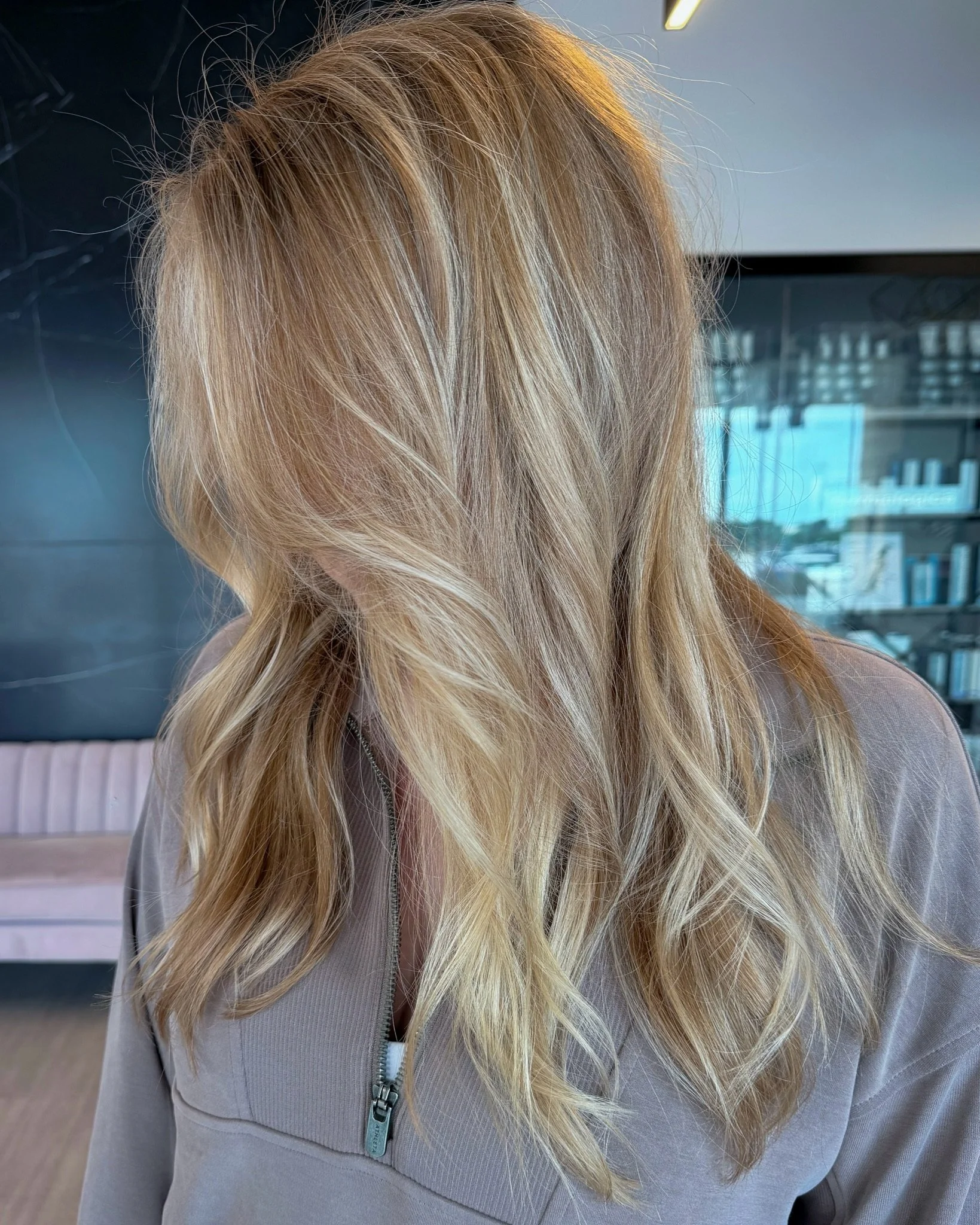 A South Jersey blonde showing off her beautiful result done by a stylist at Bloom Hair Studio in Washington Township, NJ