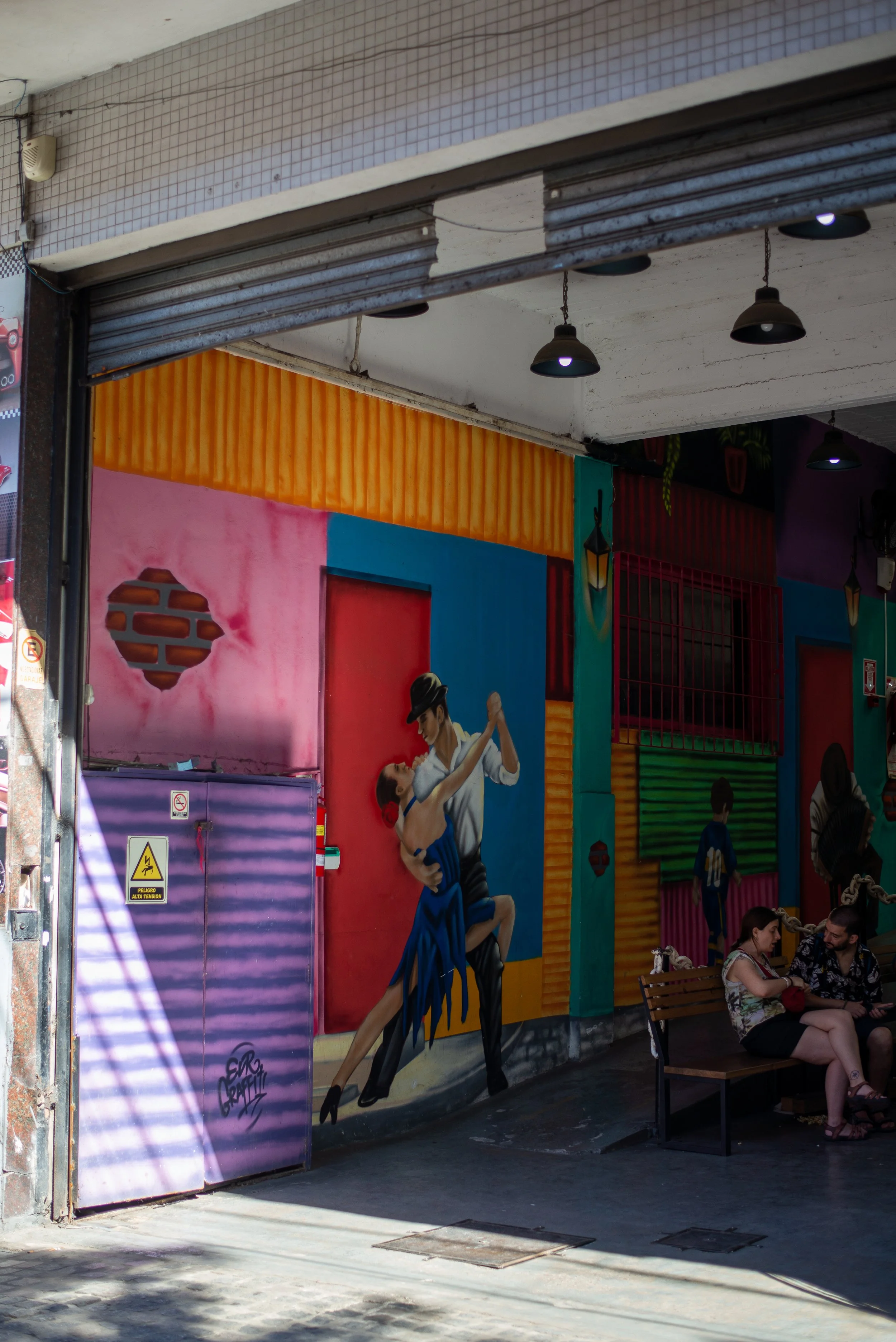 Tango-inspired street art in Buenos Aires during an All About Ballroom dance retreat.