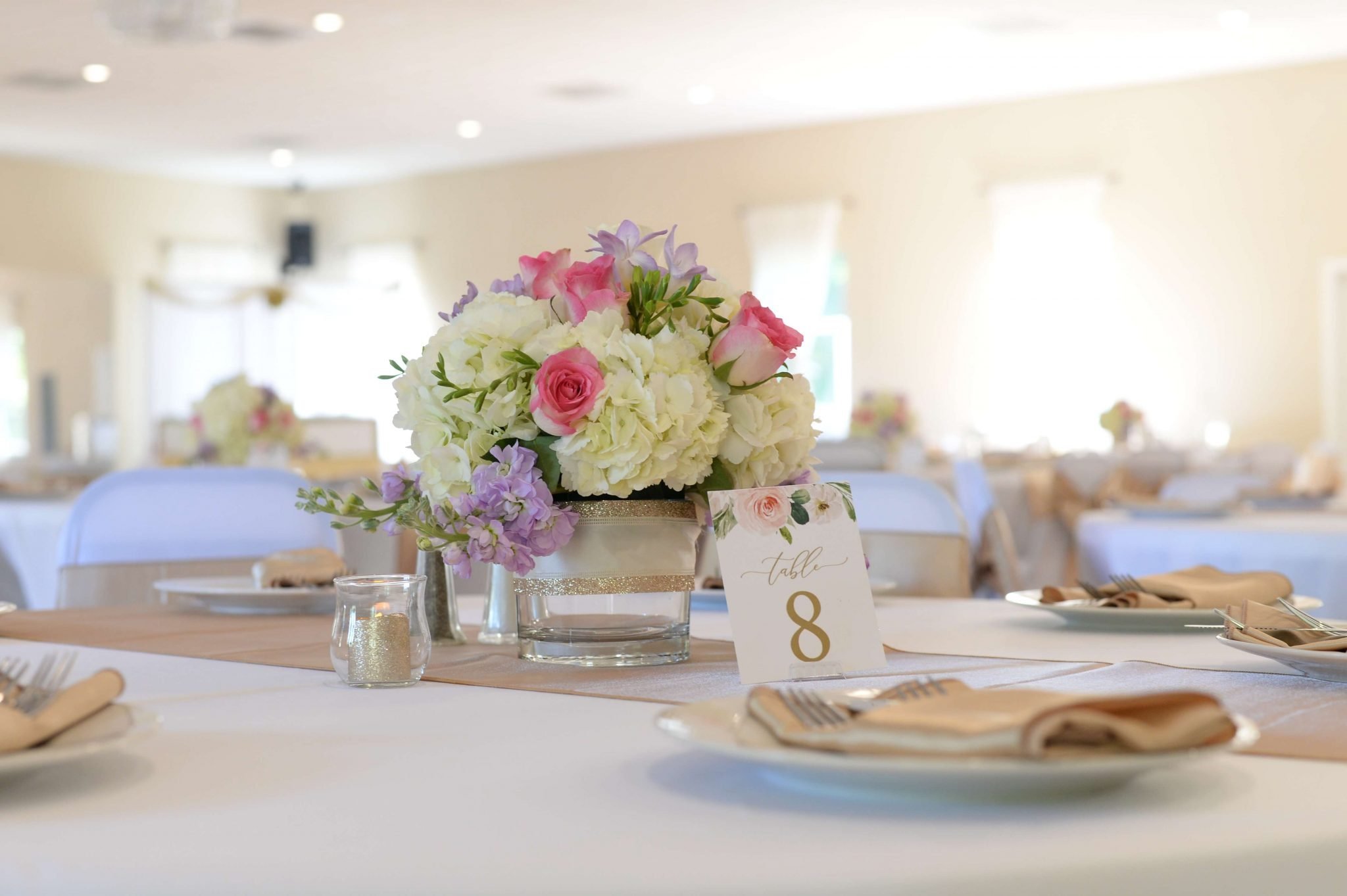 Elegant reception setup at the All About Ballroom event venue in St. Johns, Florida.