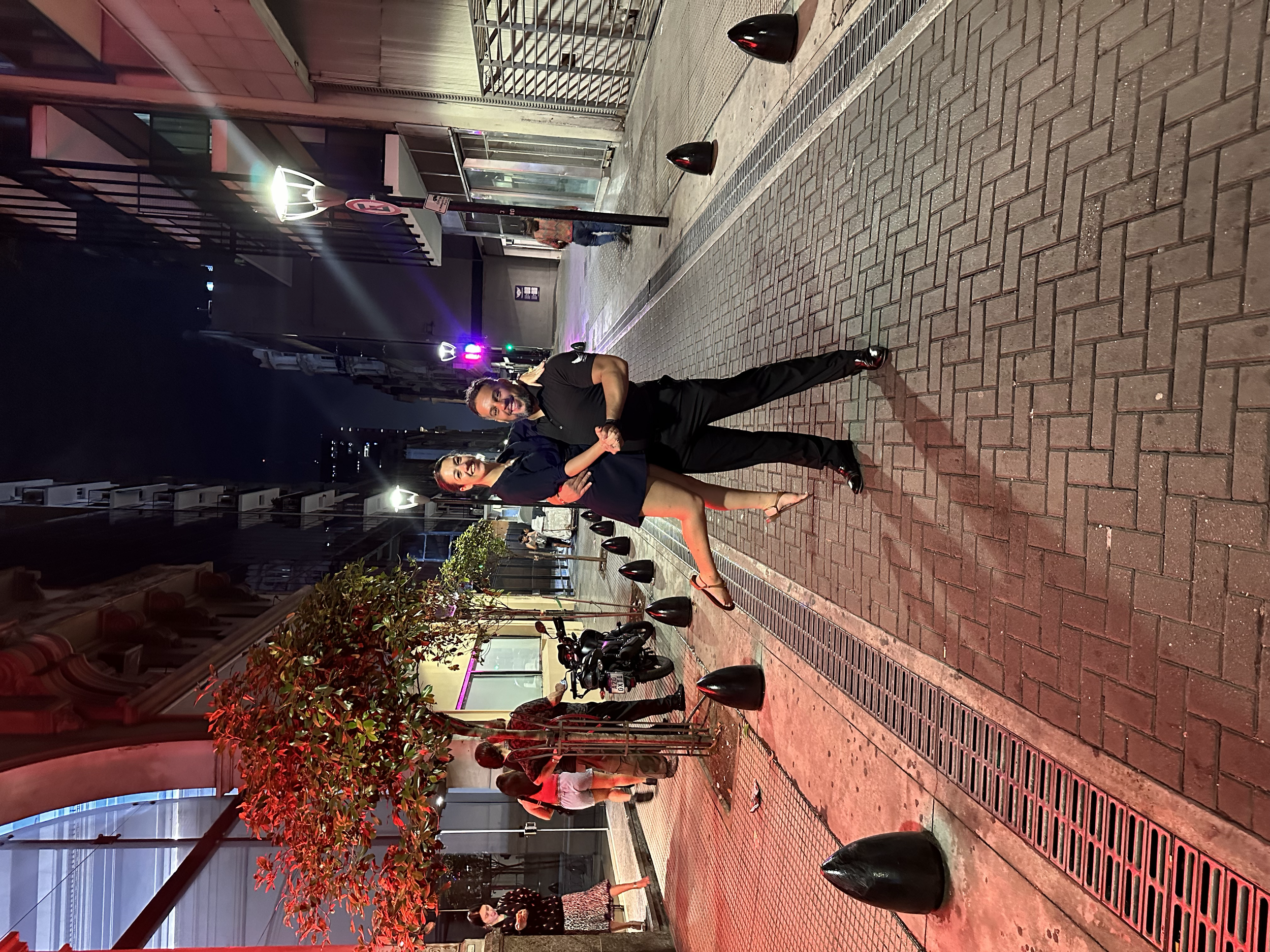 Gil Maldonado and Megan Gonzalez in a fun pose on the street outside of Marabu Milonga during an All About Ballroom dance retreat in Buenos Aires.