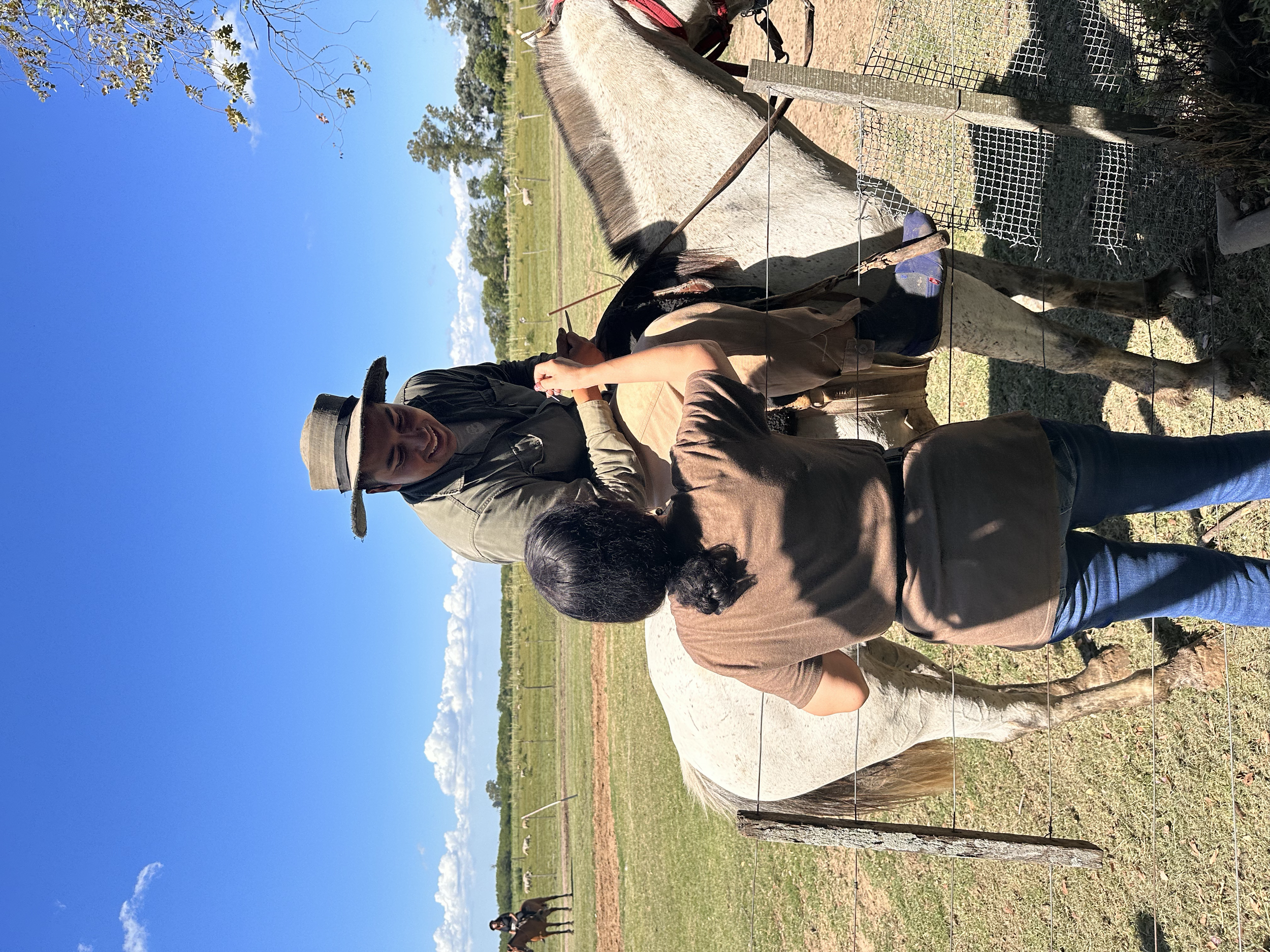All About Ballroom student accepting a playful "proposal" from a gaucho after he won a demonstration of traditional Argentine courtship games during our Argentina dance retreat.