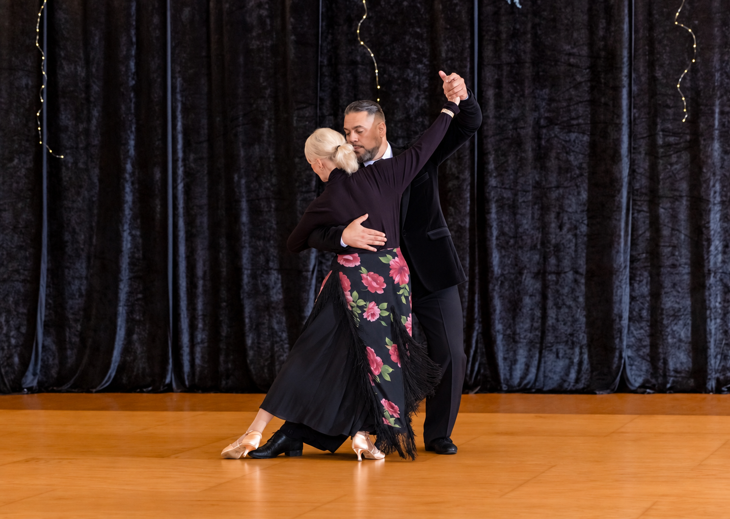 Couple performing Tango at All About Ballroom.