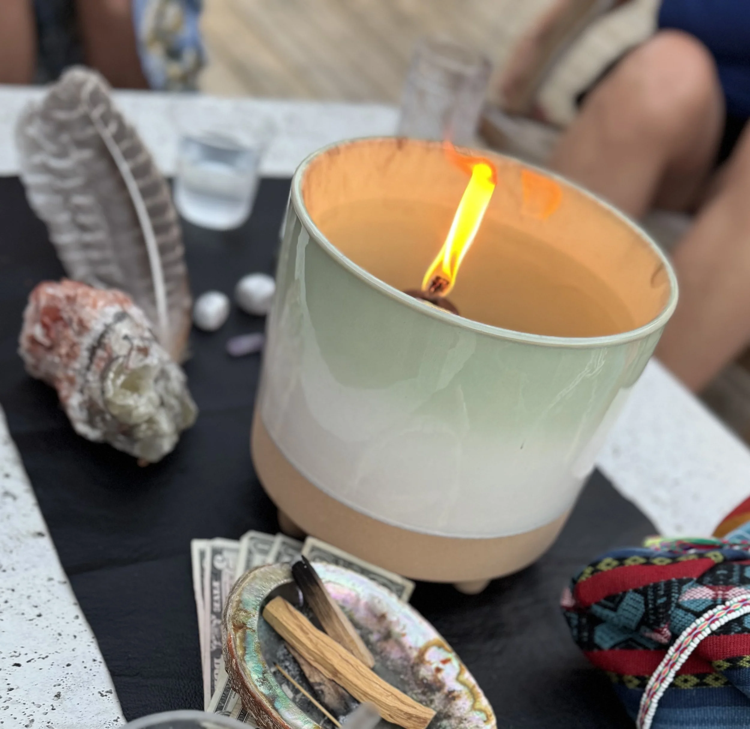 Table Top Fire and palo santo with feather wand for full moon intentions