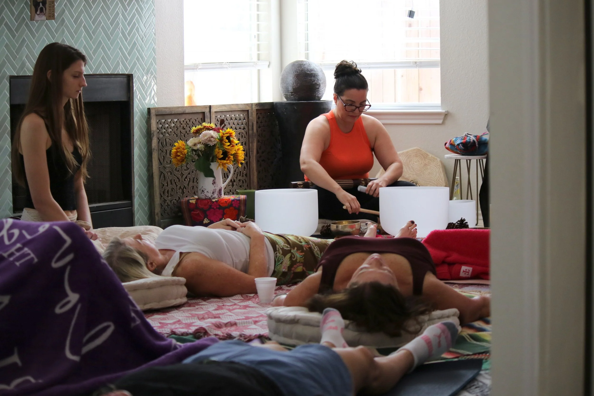 Gathering in an intimate, welcoming space to slow down, connect, and share the experience in community.