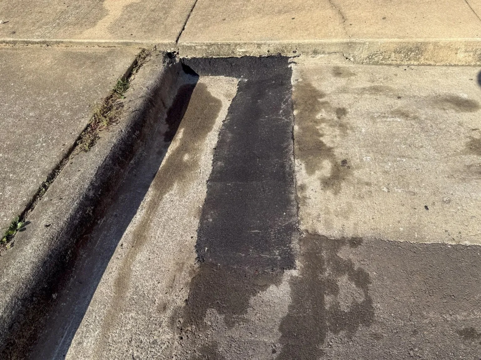 Repaired asphalt catch basin at Carrington Middle School, Durham NC