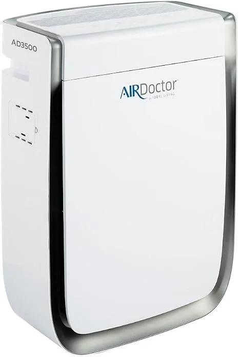 A white portable air purifier with a curved gray base and the brand name AIR Doctor on the front.