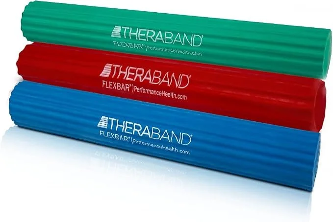 Three Therabands in green, red, and blue, laying horizontally on a white surface.
