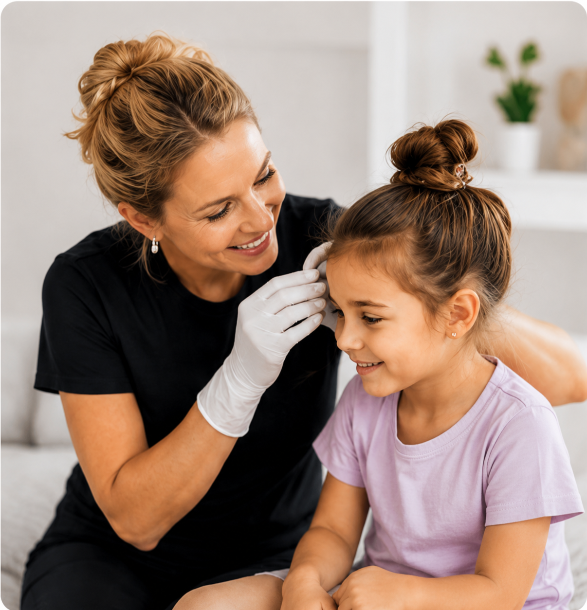 A woman in medical gloves administers an injection to a smiling young girl with brown hair tied in a bun, in a bright home setting.