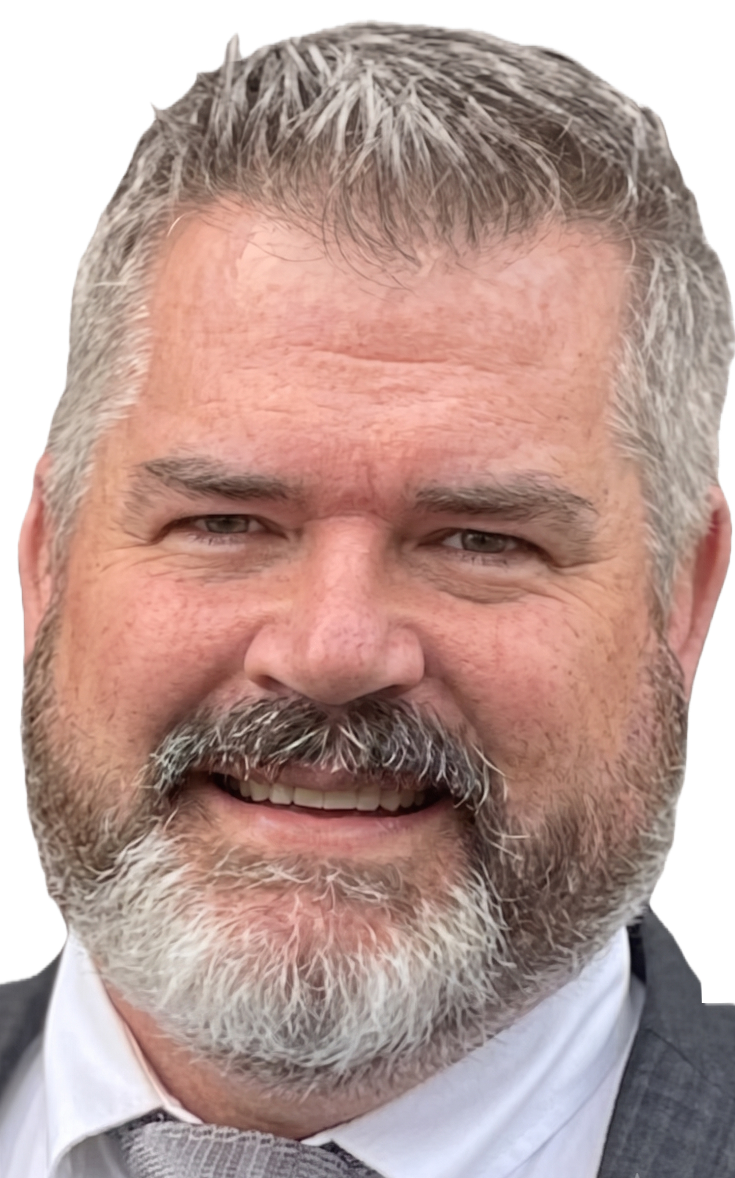 A smiling middle-aged man with gray hair and a beard, wearing a suit and tie.