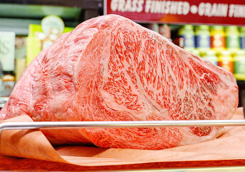 A large, marbled cut of Kobe beef.