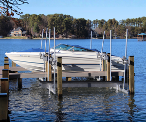 Boats docked on a boat lift at a marina