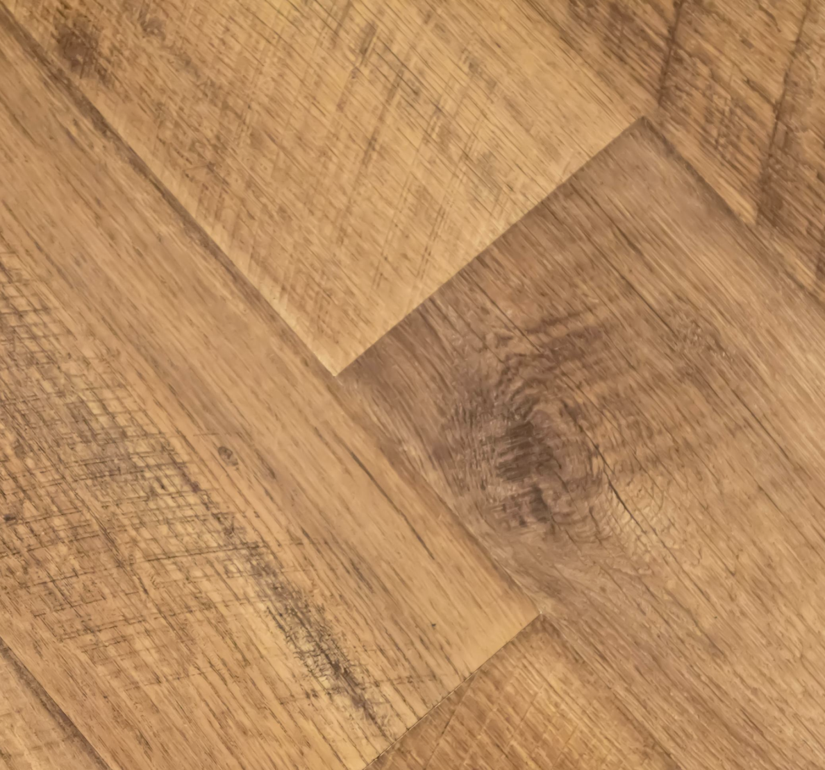 Close-up view of wooden flooring with visible wood grains and knots.