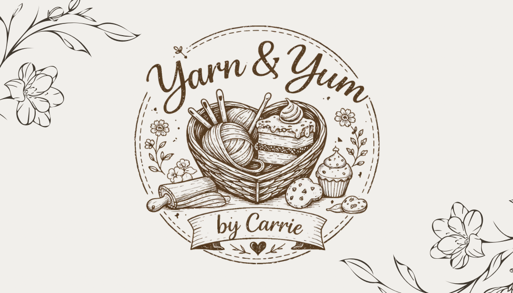 Logo for Yarn & Yum by Carrie featuring a basket with yarn and baked goods, surrounded by floral accents.
