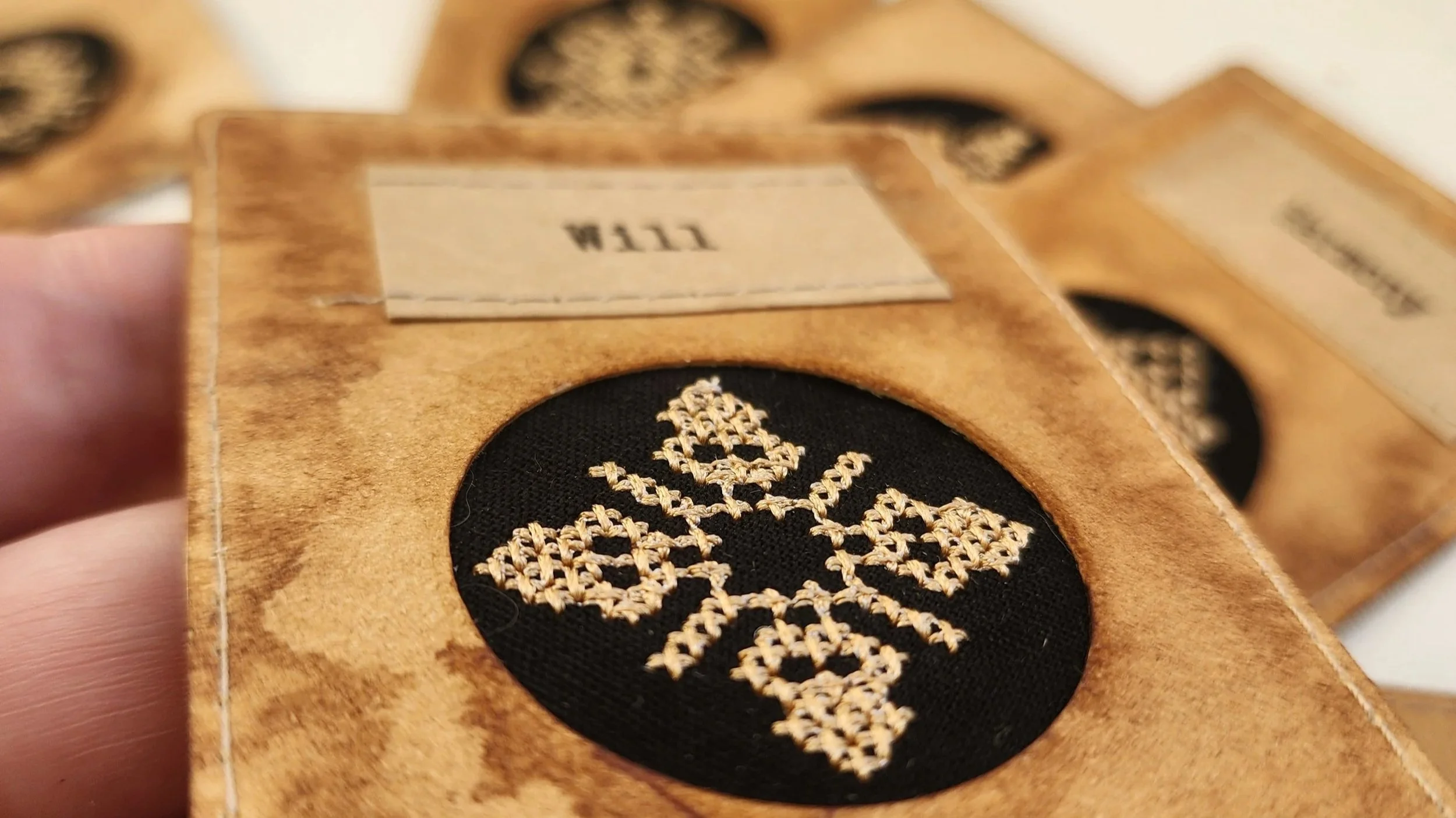 Handmade ACEO art card featuring the word Will as an embroidered encoded ornament