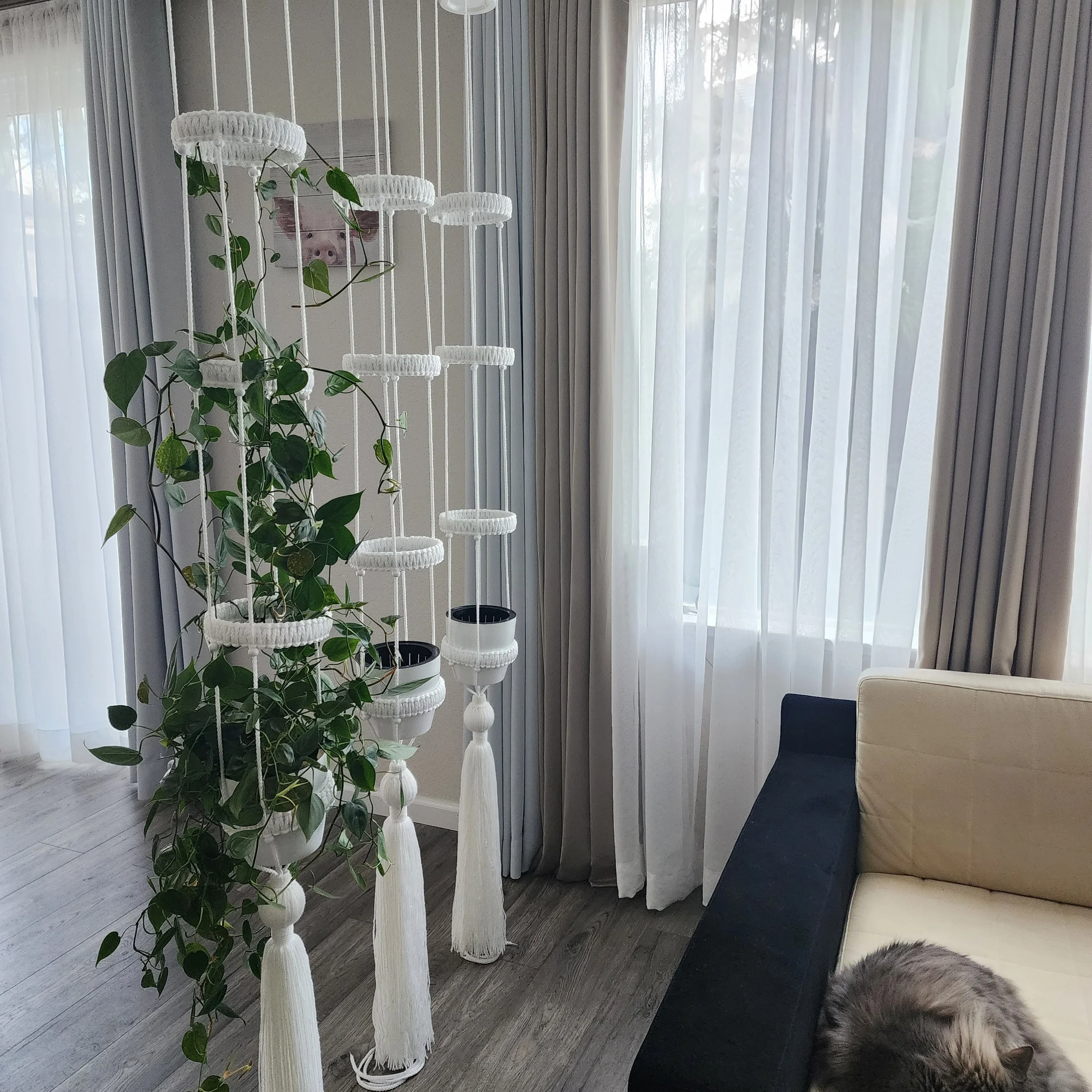 OMM Depot Smart Water vertical planters with adjustable rings and self-watering pots in a living room