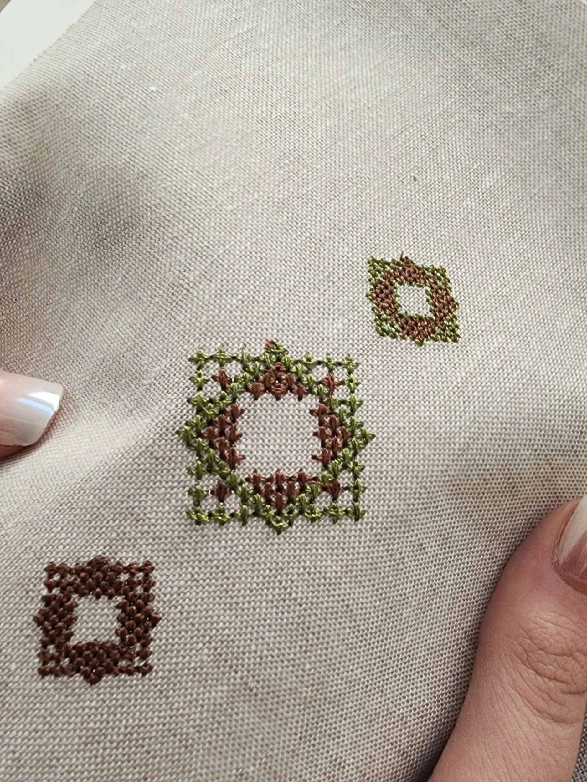 Geometric word ornaments created with the OMM Depot Encoded Intention method and embroidered on linen
