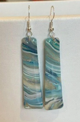 Pair of rectangular marble patterned earrings with silver hooks.