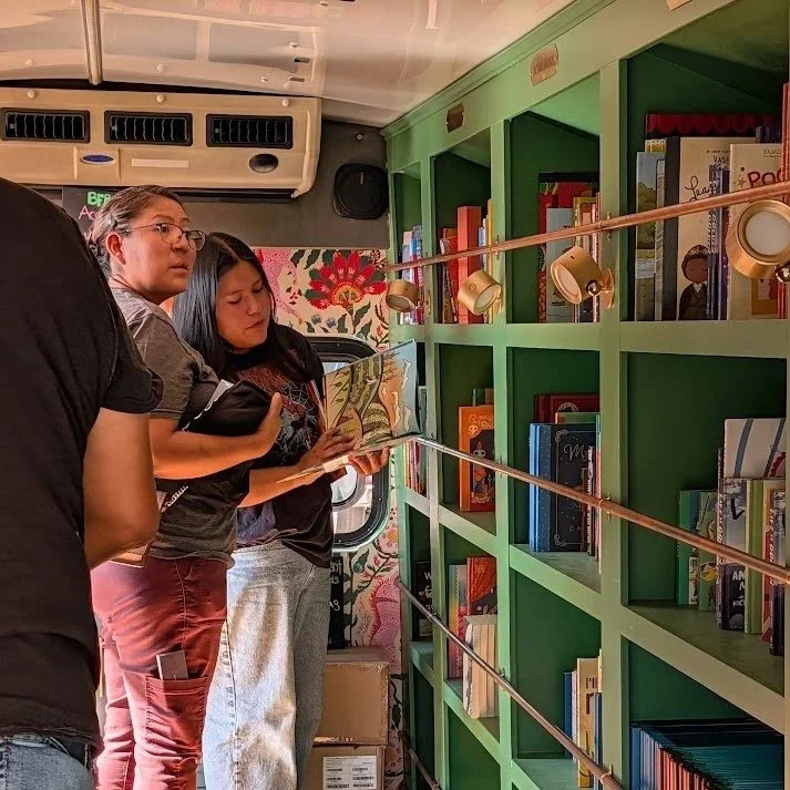 people browsing books in the bookmobile