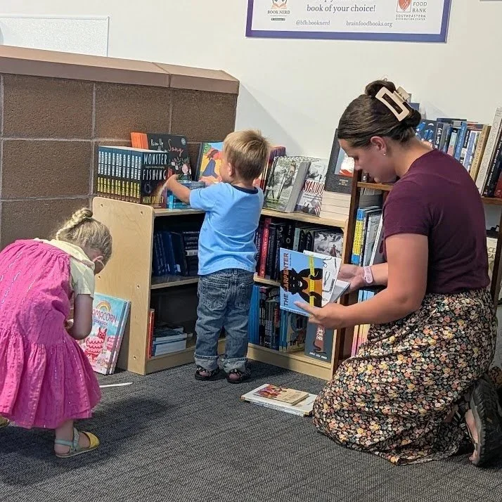 Family picking out books at San Juan County book pantry