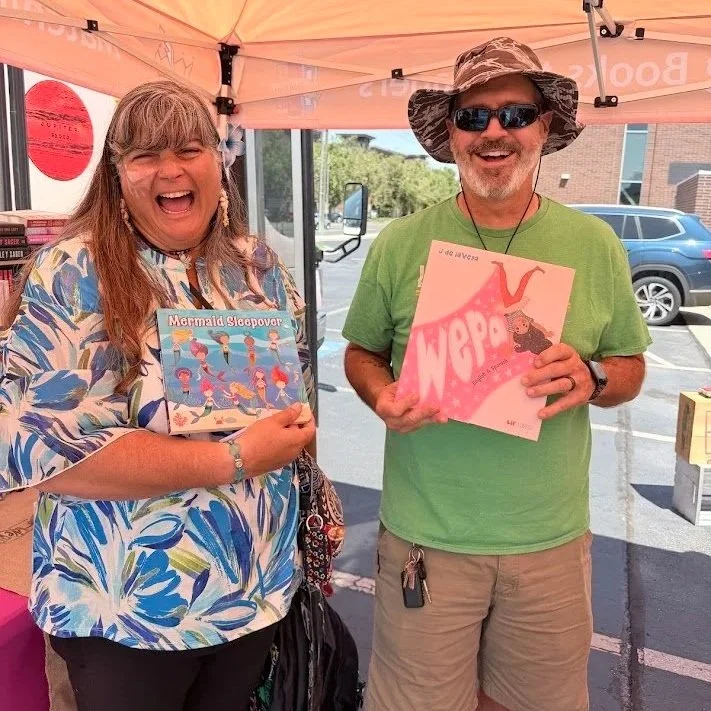 smiling people at bfb event holding books