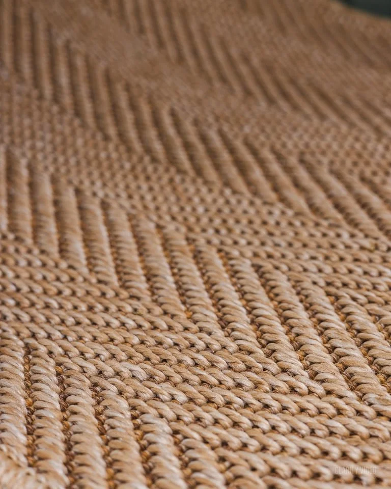 Close-up of a woven textured surface, likely made of natural fibers.